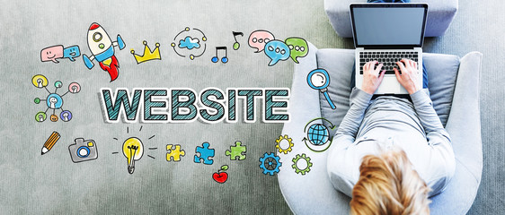 Wall Mural - website text with man using a laptop