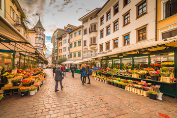 Wall Mural - People going shopping in the streets of Bolzano