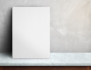 Wall Mural - Blank White paper poster on black marble table at grey concrete wall,Template mock up for adding your design and leave space beside frame for adding more text.