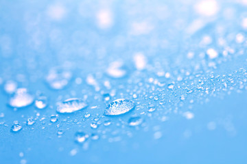 Sticker - Close up rain water drops on blue sponge surface as abstract background