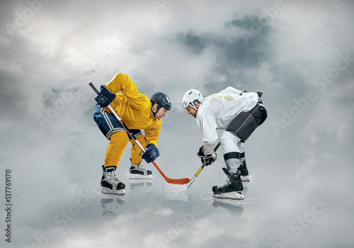 Fototapeta na szkło Ice hockey player on the ice, outdoors