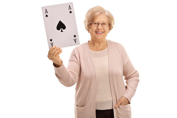 Poster - Happy mature woman showing an ace of spades card