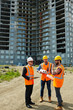 © pressmaster - Group of three men wearing protective helmets and vests