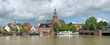 Leer, Germany. Panoramic view from Leda river on City Hall in Dutch Renaissance style, Old Weigh House in Dutch classical Baroque style, Tourist Harbor and Bridge of Erich vom Bruch.