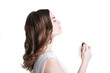 © julenochek - young woman spraying the perfume