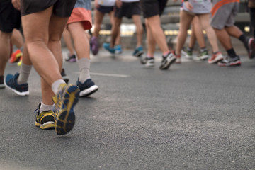 Marathon runners / View of marathon runners at Rama 8 bridge in the morning. Movement.