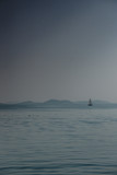 Fototapeta  - Jacht na tle odległych wysp