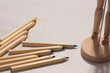 colorful pencils on a table with puppet