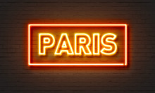 Paris Neon Sign On Brick Wall Background.