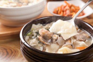 Wall Mural - bajirak sujebi. Hand-pulled Dough Soup with manila clam.