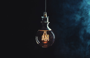 Vintage lightbulb on dark background