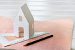 © zoomingfoto1712 - construction plan/ concept layout area, with a paper concept house