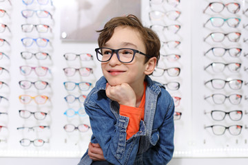 Sticker - boy in glasses , at optics store

