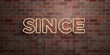 SINCE - fluorescent Neon tube Sign on brickwork - Front view - 3D rendered royalty free stock picture. Can be used for online banner ads and direct mailers..