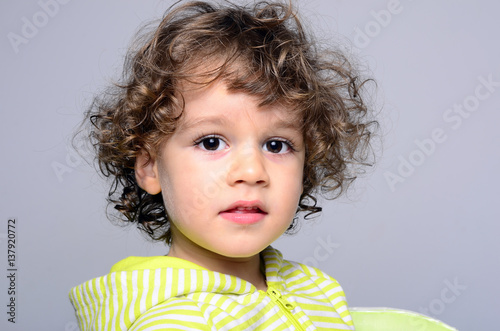 Portrait Of A Beautiful Boy With Long Curly Hair Toddler Looking