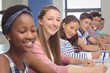 © WavebreakMediaMicro - Students sitting at desk in classroom