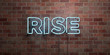 RISE - fluorescent Neon tube Sign on brickwork - Front view - 3D rendered royalty free stock picture. Can be used for online banner ads and direct mailers..