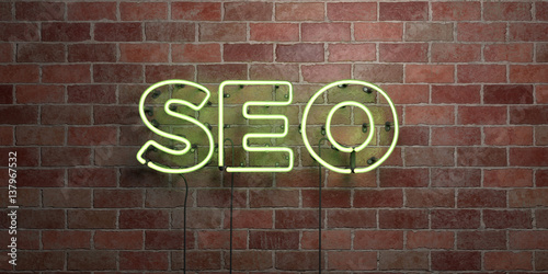 Fotografija SEO - fluorescent Neon tube Sign on brickwork - Front view - 3D rendered royalty free stock picture
