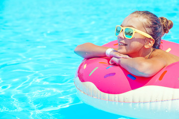 Tween girl in resort pool