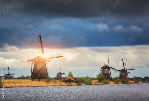 Windmills against cloudy sky at sunset in famous Kinderdijk, Netherlands Canvas