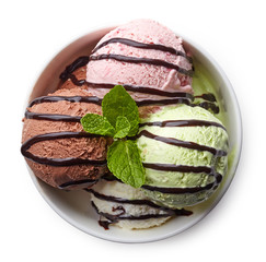 Wall Mural - Bowl of various colorful ice cream and chocolate sauce
