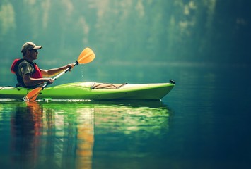senior kayaker on the lake