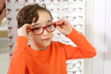 Wall Mural -  choosing glasses at optics store
