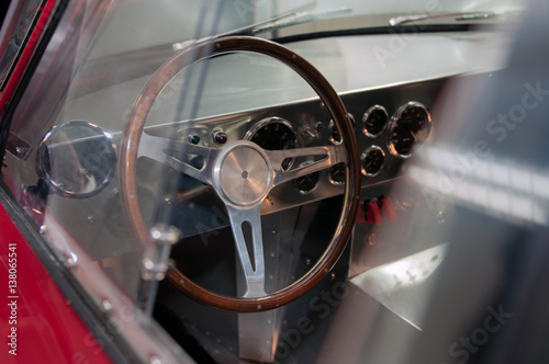 Classic Car Steering Wheel And Dashboard With Many Gauges