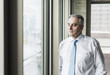 © Westend61 - Portrait of a senior manager, looking out of window