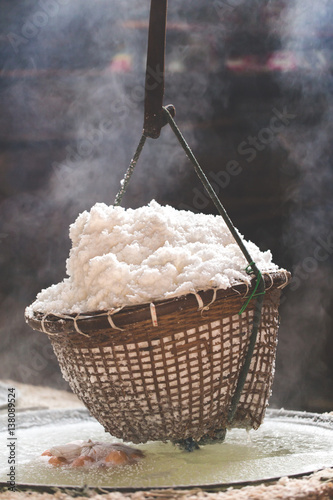 Fotografie, Obraz Boiling rock salt traditional salt making of Nan province,Thailand