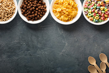 Variety of cold cereals in white bowls