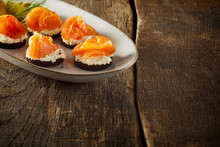 Plate Of Smoked Salmon Canapes On A Rustic Table