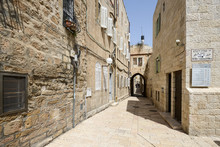 Narrow Cobbled Street Among Traditional Stoned Houses Of Jewish Quarter At Old Historic Part Of Jerusalem, Israel