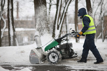 A Man Cleans The Track Park Snow Machines