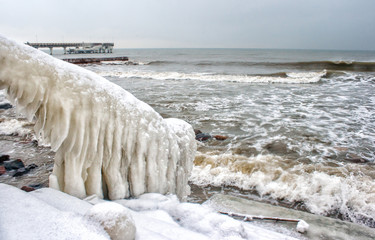 ice covered staircase on the beach