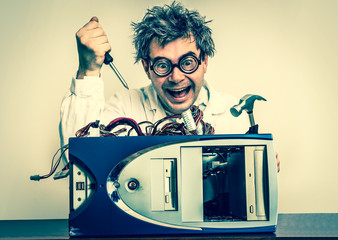 Crazy engineer or scientist repairing computer