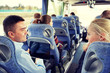 © Syda Productions - group of happy passengers in travel bus