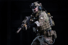 Spec Ops Soldier With Gun/SWAT Officer With Rifle In Hands, In Helmet With Night Vision Devices And Other Military Equipment