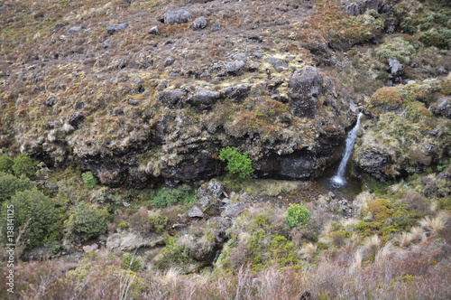 Cuadros en Lienzo Waterfall in Mordor below Mount Doom (Mount Ngaunuhoe) Walkway at Tongariro Alpi