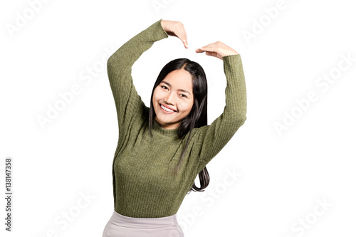 Portrait Of A Beautiful Asian Woman Smiling And Showing Love Sign Hand 
