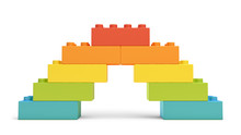 3d Rendering Of Multi-colored Toy Blocks Making Up A Rainbow Bridge.