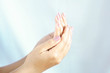 © doucefleur - close up of beautiful Asian woman hands with both palms facing up.