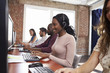 © Monkey Business - Staff Working In Busy Customer Service Department Shot