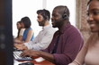 © Monkey Business - Staff Working In Busy Customer Service Department Shot