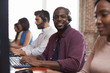 © Monkey Business - Portrait Of Staff In Busy Customer Service Department Shot