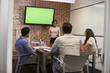 © Monkey Business - Businesswoman Standing By Screen To Deliver Presentation