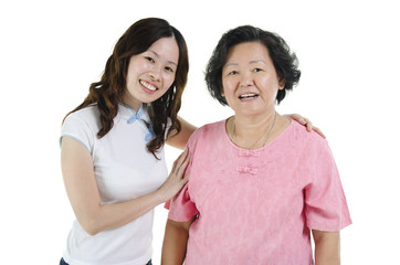 Wall Mural - Asian senior mother and adult daughter smiling