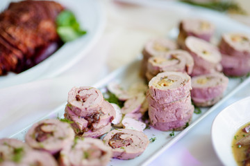 Wall Mural - Delicious pork rolls with vegetables served on a party or wedding reception