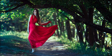 Photo Of Fashion Sexy Woman In Red Dress In Fairy Forest. Beauty Springtime