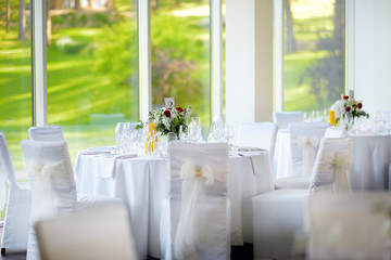 Beautiful table setting with crockery and flowers for a party, wedding reception or other festive event